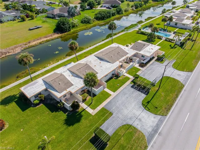 Aerial perspective of suburban area with a nearby body of water