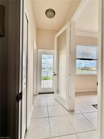 Doorway to private bed and bath with access to patio plenty of natural light