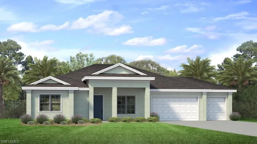 View of front of property with a garage and a front yard