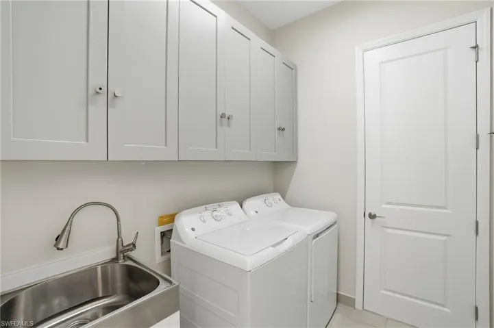 Large laundry room with sink