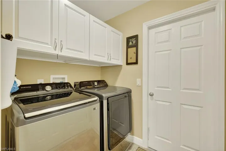 Laundry area with cabinet space and washer and dryer