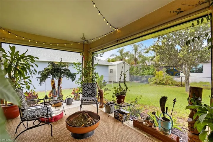 View of patio with an outdoor fire pit
