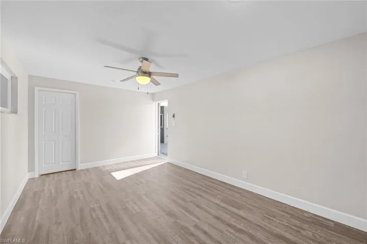 Spare room featuring light wood-style floors and ceiling fan