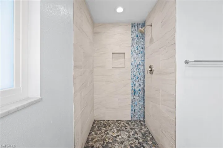 Bathroom featuring a shower stall