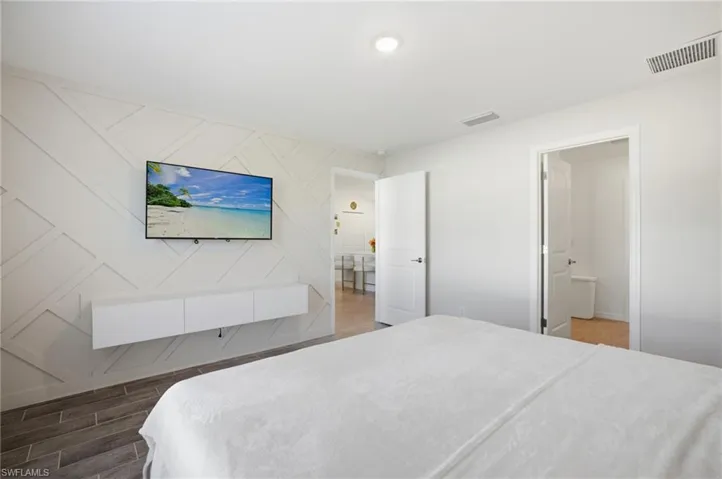 Bedroom featuring wood finish floors