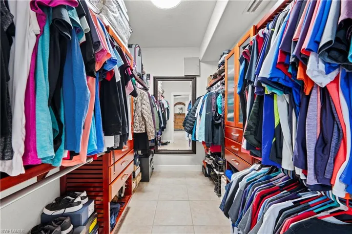 Walk in closet featuring light tile patterned floors