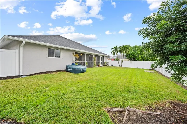 View of yard with a sunroom
