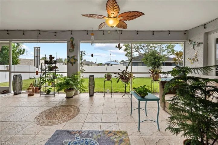 Sunroom featuring a healthy amount of sunlight and ceiling fan