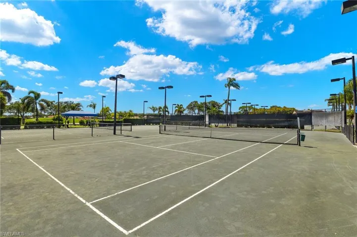 View of sport court featuring fence