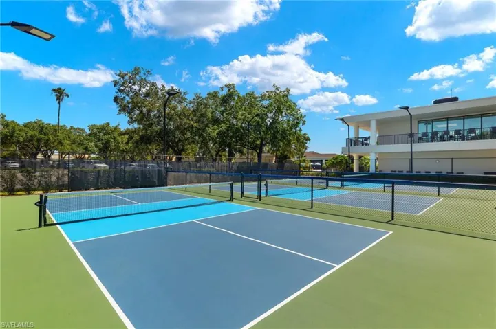 View of sport court featuring fence