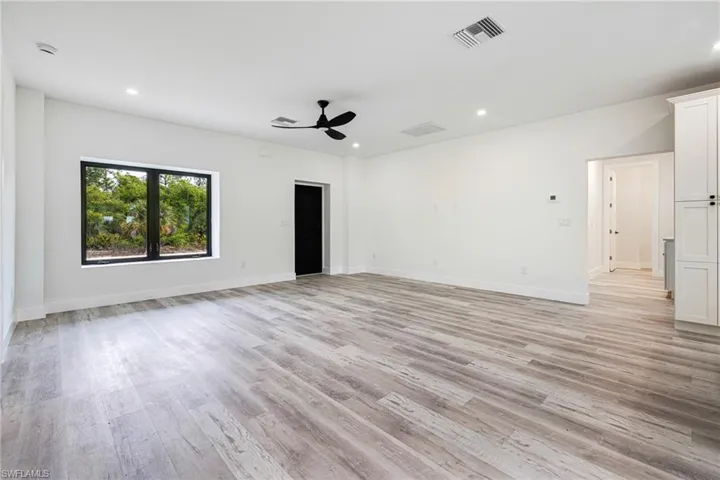 Spare room featuring visible vents, light wood-style floors, recessed lighting, and a ceiling fan