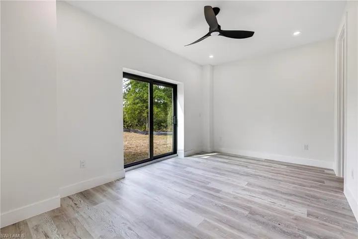 Unfurnished room with recessed lighting, baseboards, light wood finished floors, and ceiling fan
