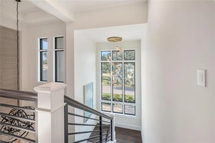 Staircase to Upstairs en-suite bedrooms, loft area, office, wet bar