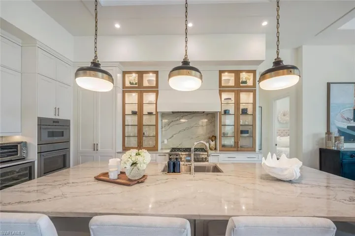 Island Counter showing decorative lighted cupboards.