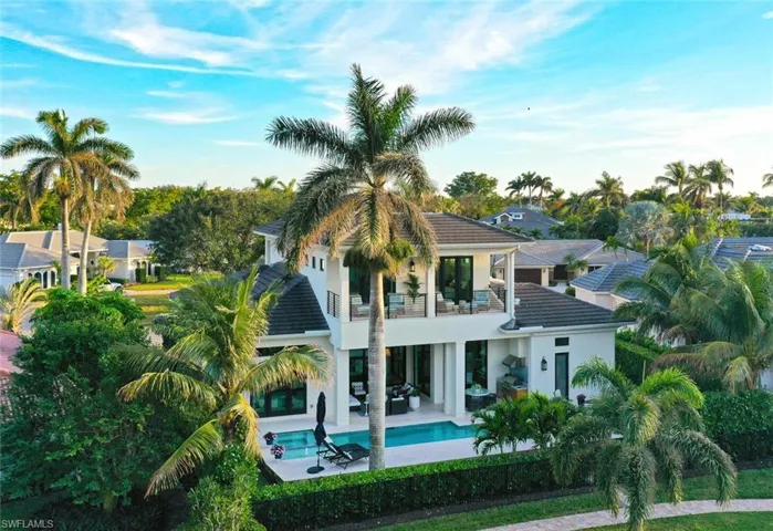 Aerial view of back of home.  SO much outdoor living space, with upstairs balconies too!