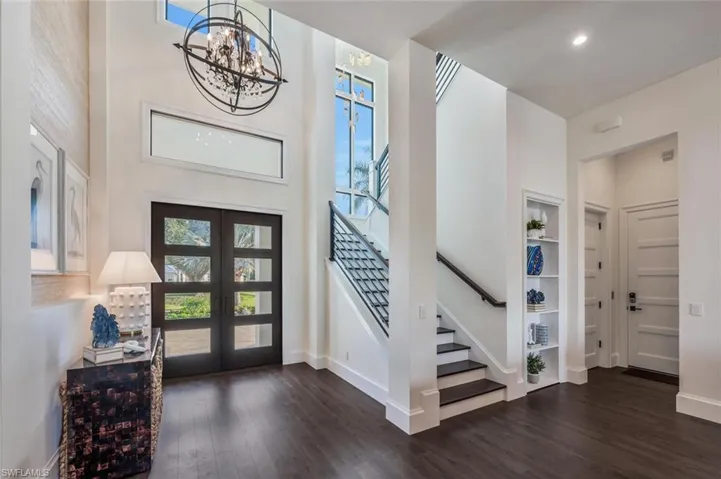 Beautiful front doors, Hidden Closet right of stairway, and elevator entrance