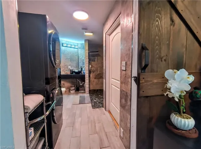 Primary bath with laundry and walk-in closet