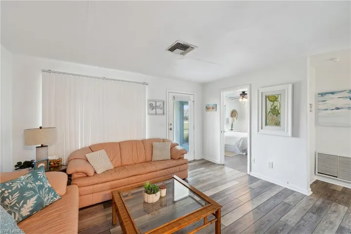 Living room featuring wood finished floors and baseboards