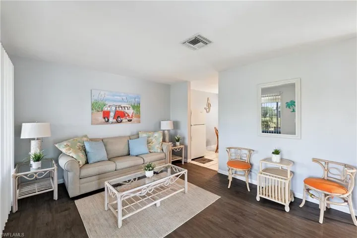 Living room featuring wood finished floors and baseboards