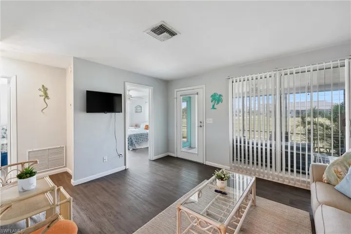 Living area featuring wood finished floors and baseboards