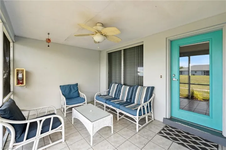 View of patio featuring ceiling fan