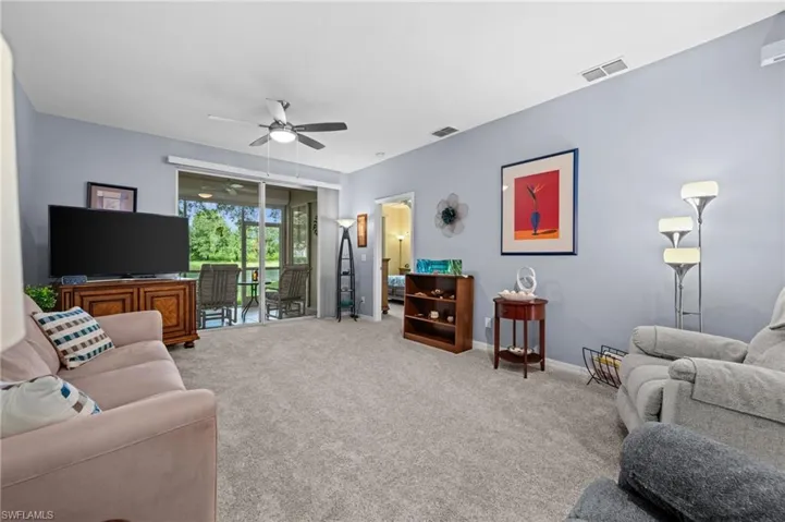 Wall-to-wall carpeting and light blue walls