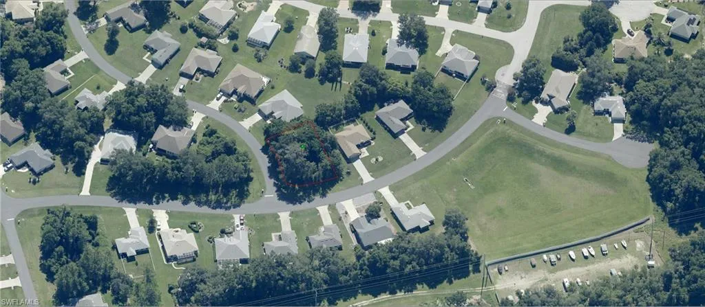 Aerial perspective showcasing a residential community with mature tree coverage
