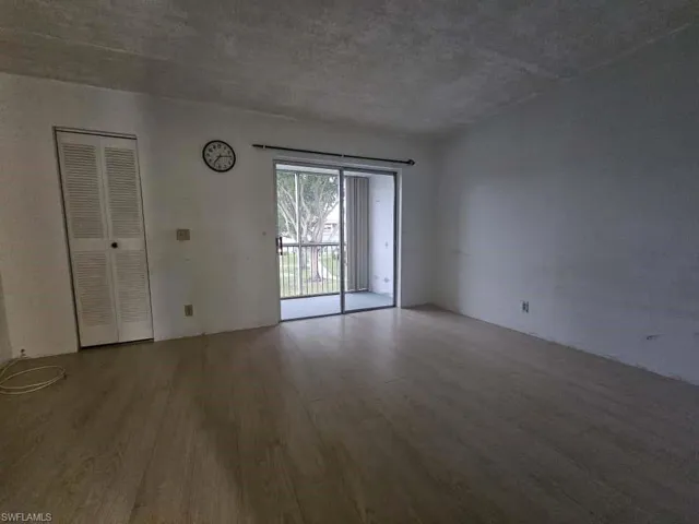 Spare room with wood finished floors