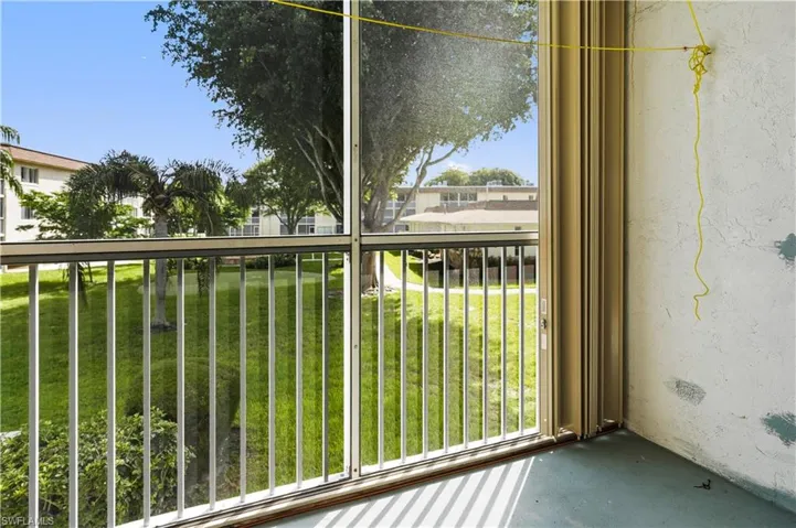 Balcony featuring a sunroom