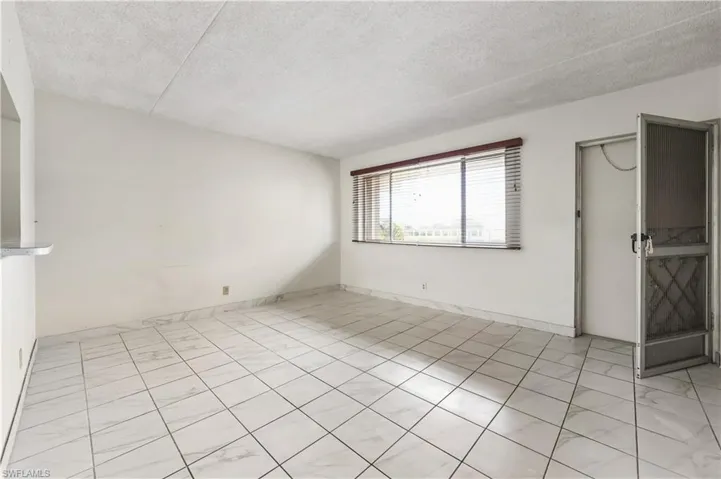 Empty room featuring a textured ceiling