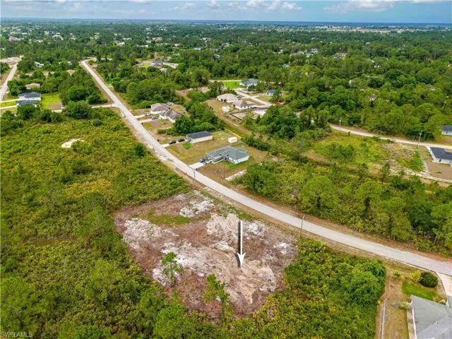 View of property location featuring a heavily wooded area