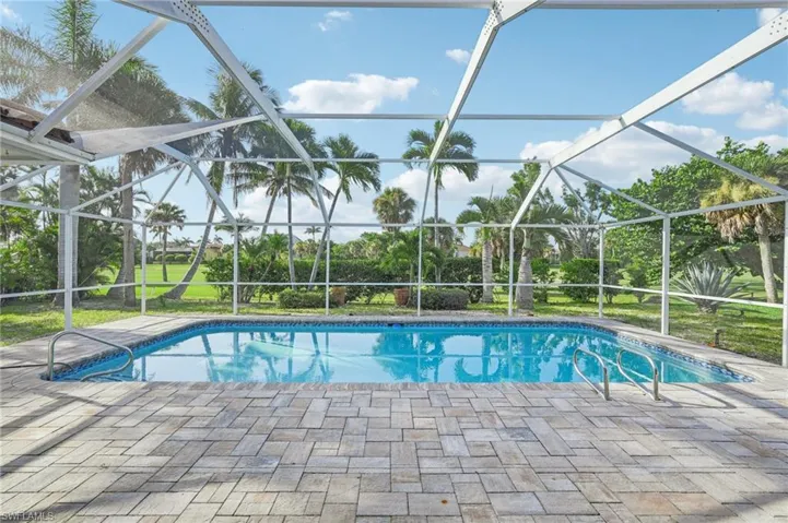 Swimming pool with a patio area and a lanai