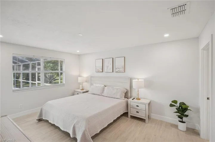 Bedroom with recessed lighting and light wood-style flooring
