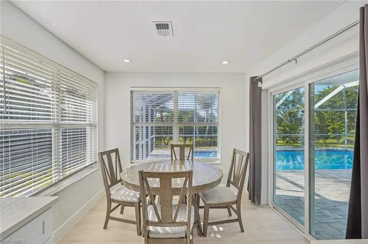 Dining room featuring light wood finished floors and recessed lighting