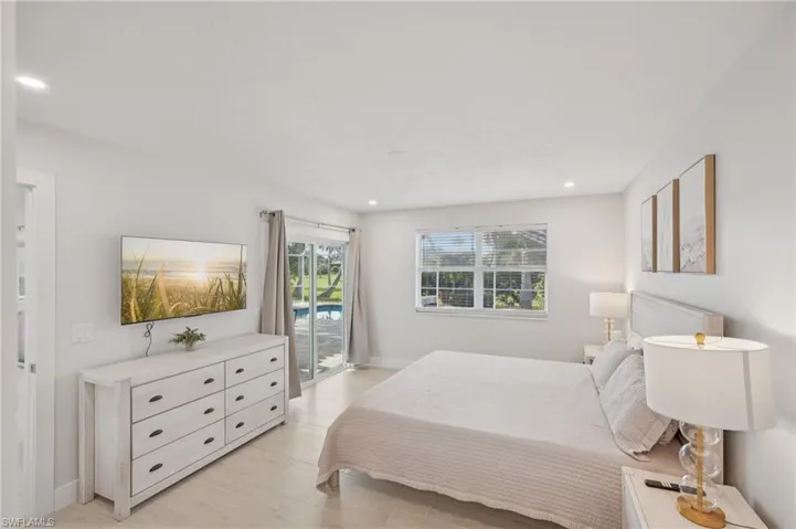 Bedroom with access to outside, recessed lighting, and light wood-type flooring