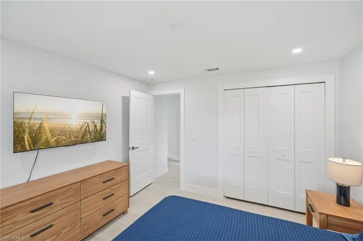 Unfurnished bedroom with recessed lighting and a closet