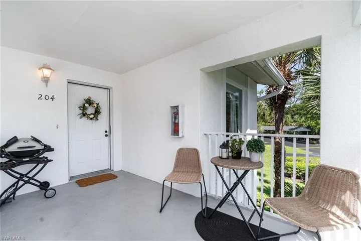 Property entrance with stucco siding
