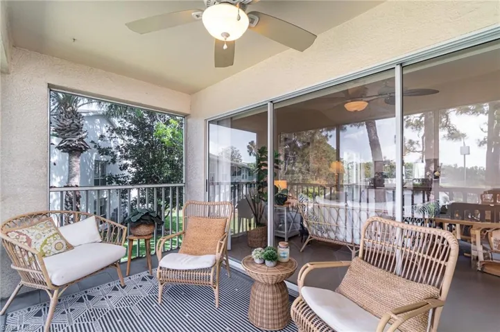 Sunroom featuring a ceiling fan and an outdoor hangout area