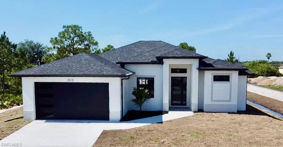View of front of property featuring a garage