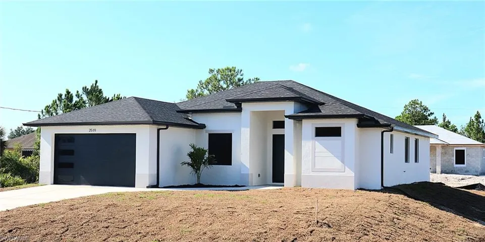 View of front of home featuring a garage