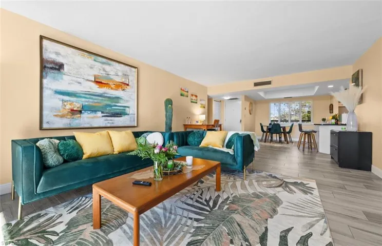 Living area featuring wood finished floors and baseboards