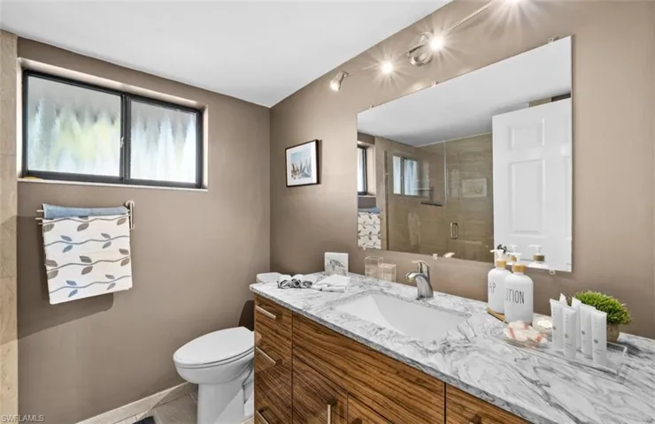 Bathroom with vanity and a shower stall