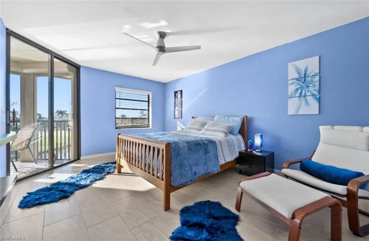 Bedroom featuring access to exterior and ceiling fan