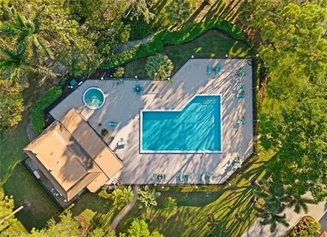 View of subject property with a pool