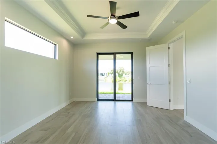 Masterbedroom, raised ceiling, and plenty of natural light