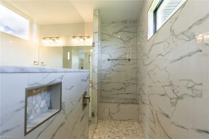 Bathroom with niches and sitting area