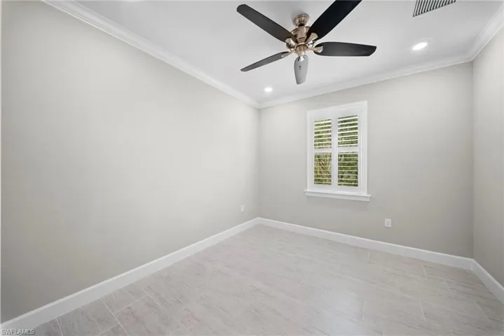 Empty room featuring crown molding, recessed lighting, and ceiling fan