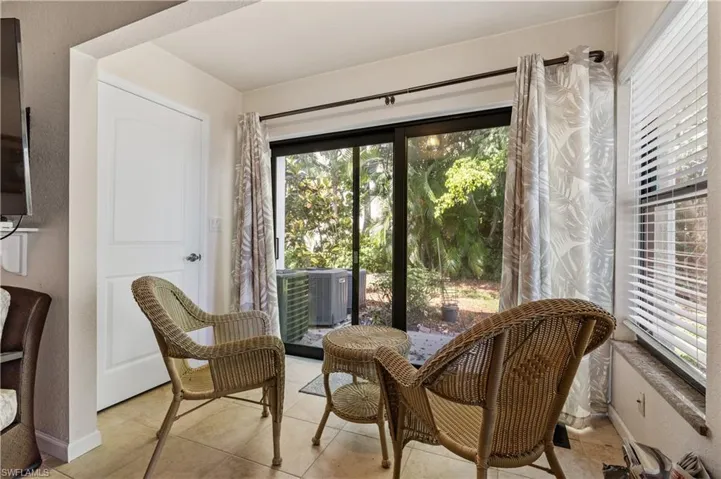 Sitting room with light tile patterned floors