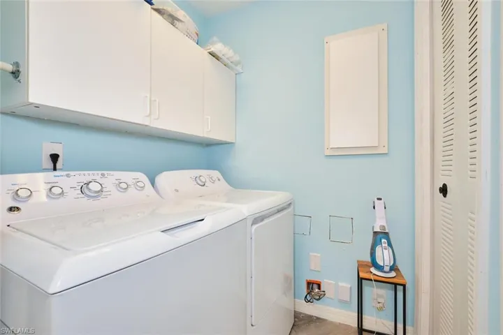 Laundry area with cabinet space and washer and dryer