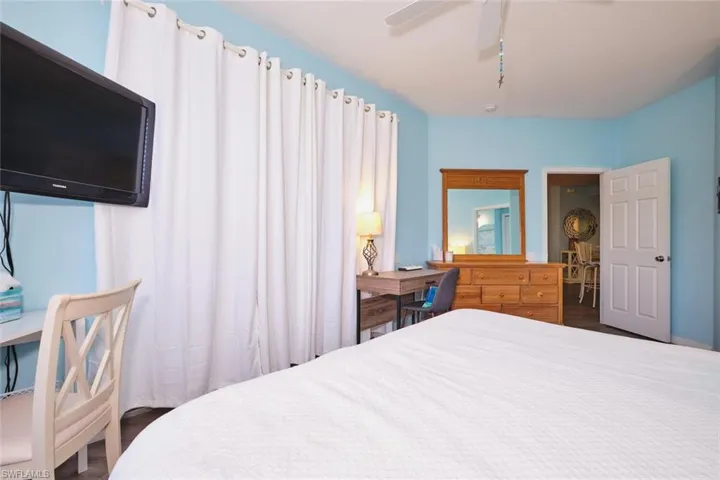 Bedroom featuring wood finished floors and ceiling fan